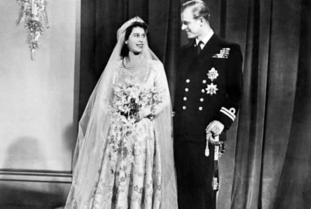 Princess Elizabeth (future Queen Elizabeth II) (L) and Philip, Duke of Edinburgh (R) pose on their wedding day at Buckingham Palace in London on November 20, 1947. 