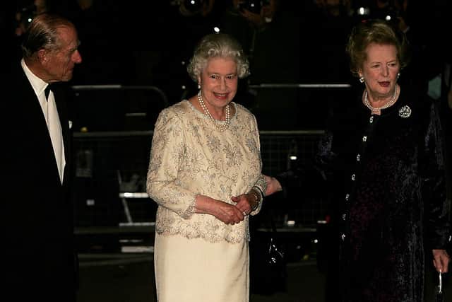 Former British Prime Minister Baroness Margaret Thatcher greets Queen Elizabeth II and Prince Philip, Duke of Edinburgh, as they arrive for Thatcher’s 80th birthday party. Credit: Getty Images