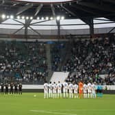 Zurich’s and Arsenal’s players line up during a minute of silence following the announcement of the death of Britain’s Queen Elizabeth II. Credit: URS BUCHER/AFP via Getty Images
