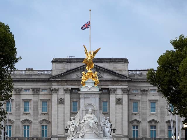 The Union flag flies at half-mast over Buckingham Palace following the death of the Queen