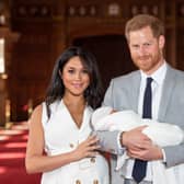 Prince Harry, Duke of Sussex and Meghan, Duchess of Sussex, pose with their newborn son Archie Harrison Mountbatten-Windsor during a photocall in St George's Hall at Windsor Castle on May 8, 2019 in Windsor, England. The Duchess of Sussex gave birth at 05:26 on Monday 06 May, 2019. (Photo by Dominic Lipinski - WPA Pool/Getty Images)