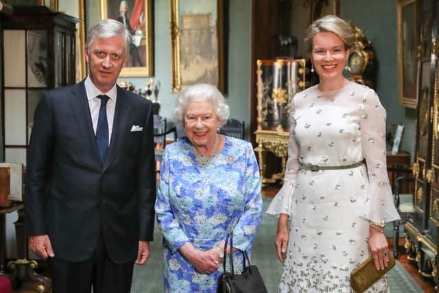 Queen Elizabeth II poses with King Philippe of Belgium and Queen Mathilde of Belgium. (Photo by Andrew Matthews - WPA Pool/ Getty Images)