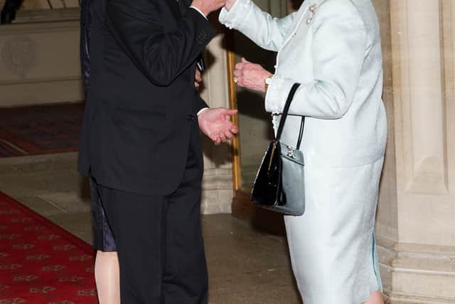 Queen Elizabeth II greeting King Carl XVI Gustaf of Sweden and Queen Silvia of Sweden in 2012 (Getty Images)