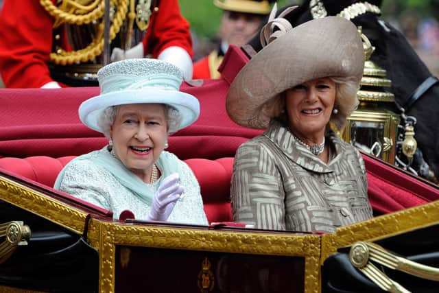 Queen Elizabeth and Camilla, Duchess of Cornwall pass the mall after Diamond Jubilee service of thanksgiving at St.Paul's Cathedral during the Diamond Jubilee celebrations on June 5, 2012 in London, England. For only the second time in its history the UK celebrates the Diamond Jubilee of a monarch. Her Majesty Queen Elizabeth II celebrates the 60th anniversary of her ascension to the throne today with a carriage procession and a service of thanksgiving at St Paul's Cathedral. (Photo by Tom Hevezi - WPA Pool/Getty Images)