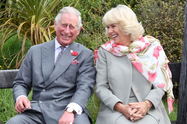 Prince Charles, Prince of Wales and Camilla, Duchess of Cornwall continue to laugh after a bubble bee took a liking to Prince Charles during their visit to the Orokonui Ecosanctuary on November 5, 2015 in Dunedin, New Zealand. The Royal couple are on a 12-day tour visiting seven regions in New Zealand and three states and one territory in Australia. (Photo by Rob Jefferies/Getty Images)