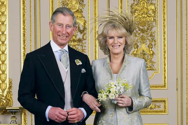 Clarence House official handout photo of the Prince of Wales and his new bride Camilla, Duchess of Cornwall in the White Drawing Room at Windsor Castle after their wedding ceremony, April 9, 2005 in Windsor, England. (Photo by Hugo Burnand/Pool/Getty Images)