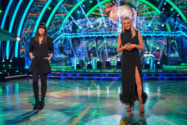 Claudia Winkleman and Tess Daly, wearing black, presenting one of the 2021 Strictly Come dancing live shows (Credit: BBC/Kieron McCarron)