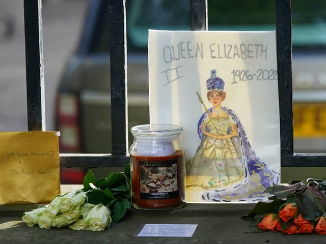 EDINBURGH, SCOTLAND - SEPTEMBER 11: A homemade card is left at the Palace of Holyroodhouse in tribute to the late Queen Elizabeth II on September 11, 2022 in Edinburgh, Scotland. Elizabeth Alexandra Mary Windsor was born in Bruton Street, Mayfair, London on 21 April 1926. She married Prince Philip in 1947 and ascended the throne of the United Kingdom and Commonwealth on 6 February 1952 after the death of her Father, King George VI. Queen Elizabeth II died at Balmoral Castle in Scotland on September 8, 2022, and is succeeded by her eldest son, King Charles III. (Photo by Ian Forsyth/Getty Images)