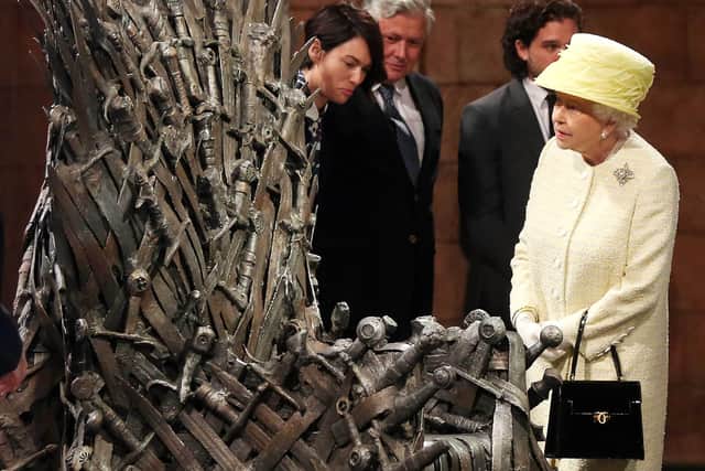 Queen Elizabeth II meets cast members of the HBO TV series ‘Game of Thrones’ as she views some of the props including the Iron Throne - June 24, 2014 in Belfast, Northern Ireland. 