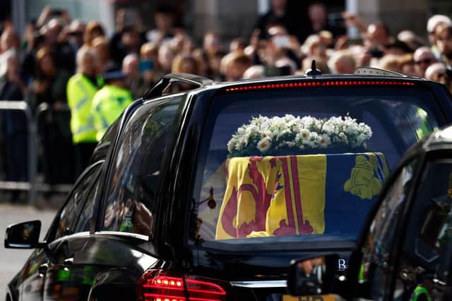 People gather in tribute as the cortege carrying the coffin of the late Queen Elizabeth II passes by (Photo: Jeff J Mitchell/Getty Images)
