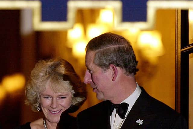 Prince Charles (R) and Camilla Parker Bowles (L) leave the Ritz Hotel after a private party to celebrate the success of Britain’s Queen Elizabeth II jubilee in central London 14 November 2002. (Photo by NICOLAS ASFOURI/AFP via Getty Images)