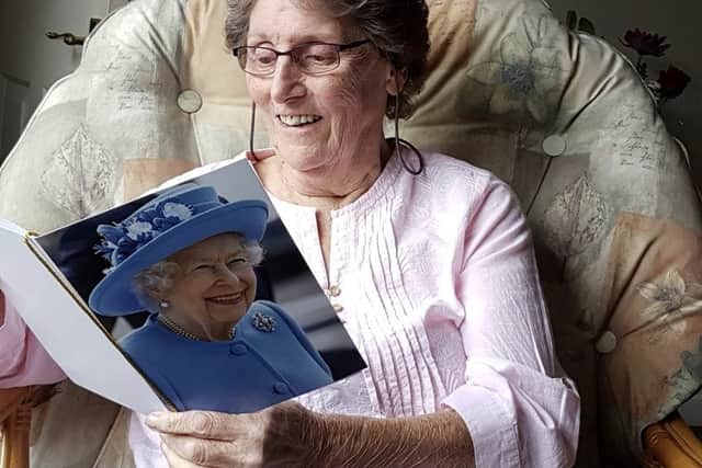 Tricia Pont opened a card from the Queen on the day she died (Photo: Ray Point / SWNS)