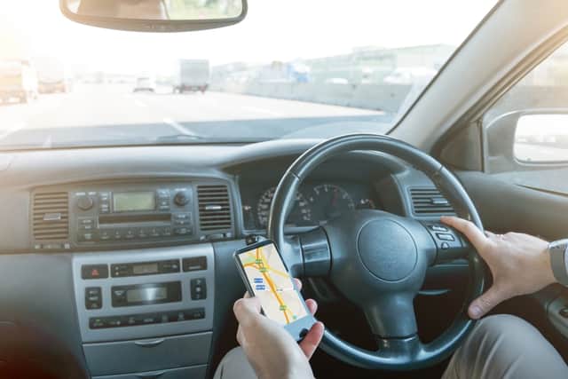 Remember that it’s illegal to use a handheld phone while driving
