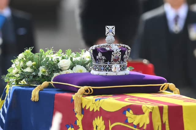 The gun carriage bearing the coffin of the late Queen Elizabeth II departs Buckingham Palace, transferring the coffin to The Palace of Westminster on September 14, 2022 in London, United Kingdom. (Photo by Daniel Leal - Pool/Getty Images)