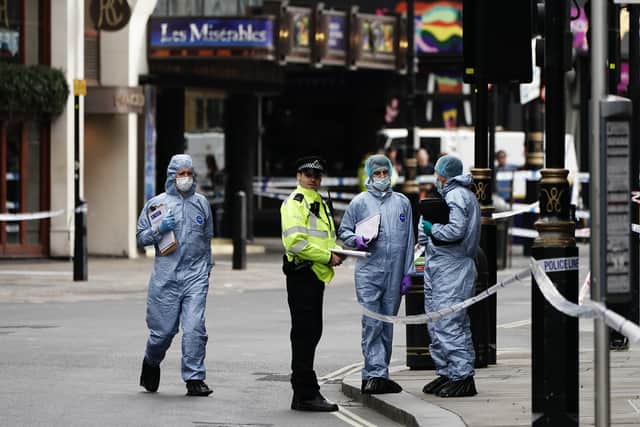 Forensics officers and police at the scene in Shaftesbury Avenue, central London, where two police officers were stabbed by a man around 6am. Credit: PA