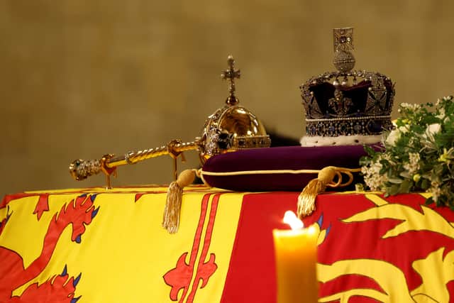 The Queen’s coffin draped in the Royal Standard with the Imperial State Crown and the Sovereign’s orb and sceptre (Pic: Getty Images)