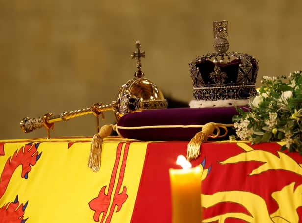 The Queen’s coffin draped in the Royal Standard with the Imperial State Crown and the Sovereign’s orb and sceptre (Pic: Getty Images)