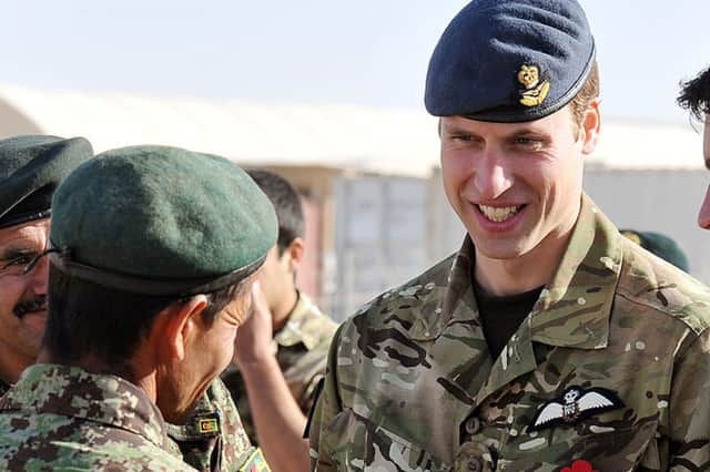 Prince William talks to a member of the Afghan Army before a Remembrance Day ceremony at Camp Bastion in 2010 (Photo: John Stillwell - WPA Pool/Getty Images)