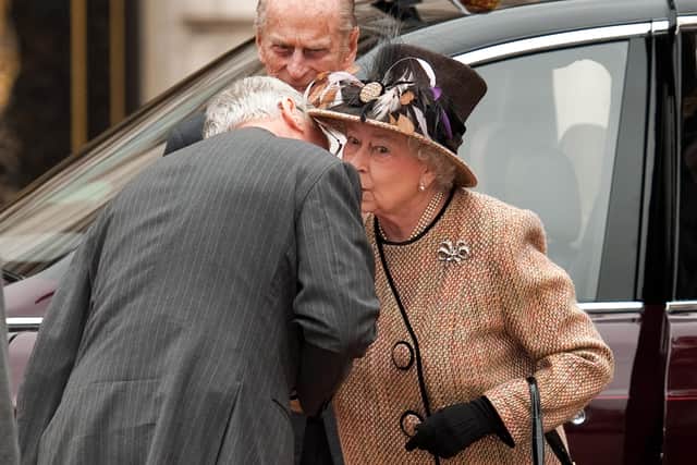  Queen Elizabeth II kisses her cousin Prince Richard, Duke of Gloucester (L) as she and Prince Philip, Duke of Edinburgh (back) arrive at the central gates of Buckingham Palace on February 29, 2012.  (Photo by Leon Neal - WPA Pool/Getty Images)