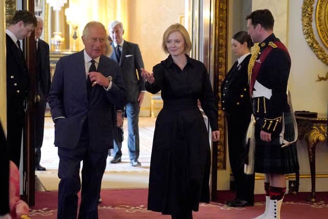 Major Thompson spotted to the right of the image with King Charles and Liz Truss (Pic:getty)