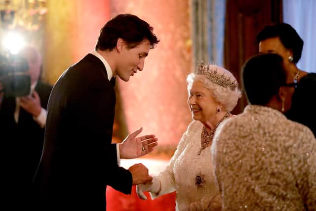 Queen Elizabeth II greets Canadian Prime Minister Justin Trudeau in a receiving line for the Queen's Dinner for the Commonwealth Heads of Government Meeting (CHOGM) at Buckingham Palace on April 19, 2018 in London, England.  (Photo by Matt Dunham - WPA Pool/Getty Images)