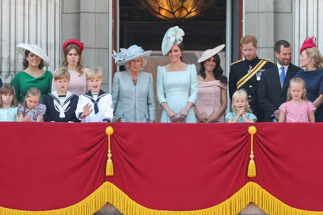 The Queen’s grandchildren and members of the Royal Family stand on the balcony of Buckingham Palace to watch the Trooping of the Colour (Pic: AFP via Getty Images)