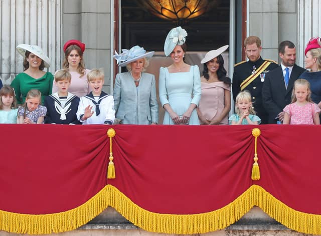 The Queen’s grandchildren and members of the Royal Family stand on the balcony of Buckingham Palace to watch the Trooping of the Colour (Pic: AFP via Getty Images)
