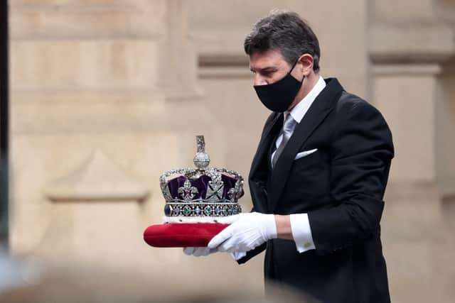 Crown Jeweller Mark Appleby carries The Imperial State Crown (Pic: POOL/AFP via Getty Images)