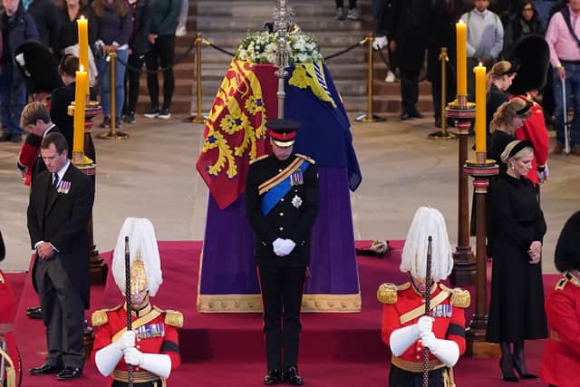 Queen Elizabeth II 's grandchildren (clockwise from front centre) the Prince of Wales, Peter Phillips, James, Viscount Severn, Princess Eugenie, the Duke of Sussex (not seen), Princess Beatrice, Lady Louise Windsor and Zara Tindall hold a vigil beside the coffin of their grandmother as it lies in state on the catafalque in Westminster Hall, at the Palace of Westminster, London. Picture date: Saturday September 17, 2022.