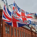 GLASGOW, SCOTLAND - SEPTEMBER 17:  A general view as a flag outside Ibrox stadium displays a tribute to Her Majesty Queen Elizabeth II, who died at Balmoral Castle on September 8, 2022, during the Cinch Scottish Premiership match between Rangers FC and Dundee United at  on September 17, 2022 in Glasgow, Scotland. (Photo by Mark Runnacles/Getty Images)