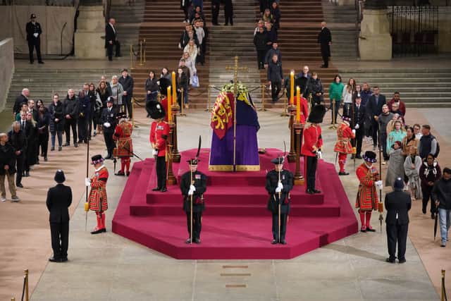 At 4.50am on the day of her funeral the final members of the public pay their respects at the coffin of Queen Elizabeth II, Lying in State inside Westminster Hall, at the Palace of Westminster on September 19, 2022 in London, England (Photo by Yui Mok - WPA Pool/Getty Images)