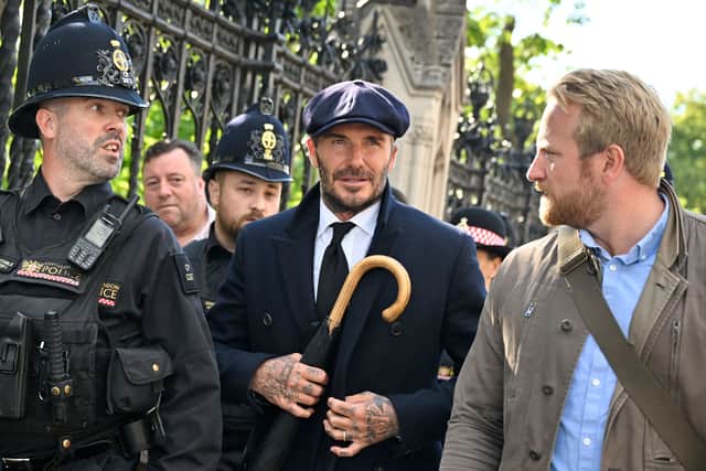 Former England footballer David Beckham was praised for joining the long queue through London on September 16, 2022 to pay his respects to the coffin of Queen Elizabeth II as it Lies in State. (Photo by LOUISA GOULIAMAKI/AFP via Getty Images)