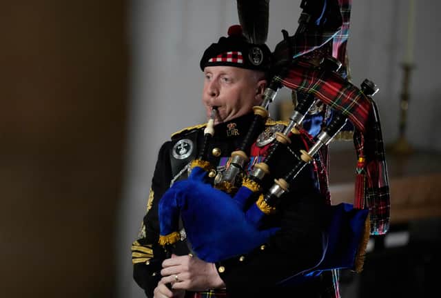 <p>Pipe Major Paul Burns plays during the State Funeral of Queen Elizabeth II at Westminster Abbey (Photo: POOL/AFP via Getty Images)</p>