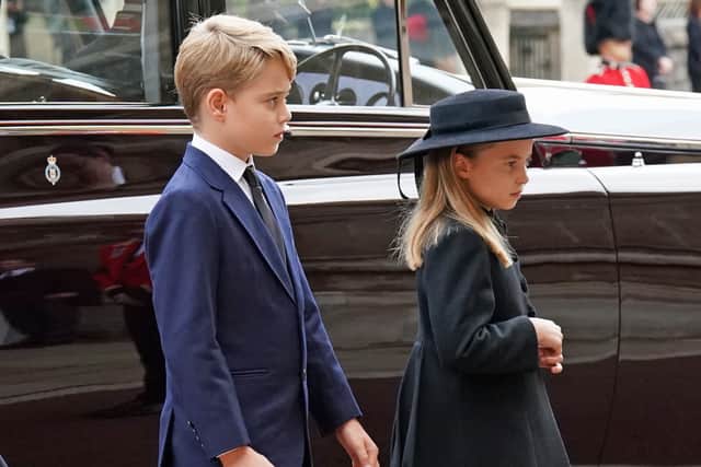 Prince George and Princess Charlotte arrive at the Committal Service for Queen Elizabeth II held at St George’s Chapel in Windsor Castle. (Photo by Kirsty O'Connor - WPA Pool/Getty Images)