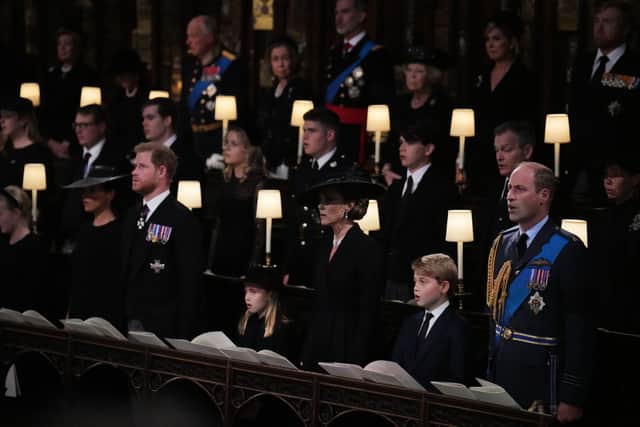  The Duchess of Sussex, the Duke of Sussex, Princess Charlotte, the Princess of Wales, Prince George and the Prince of Wales during the Committal Service for Queen Elizabeth, at St George’s Chapel in Windsor Castle. (Photo by Victoria Jones - WPA Pool/Getty Images)