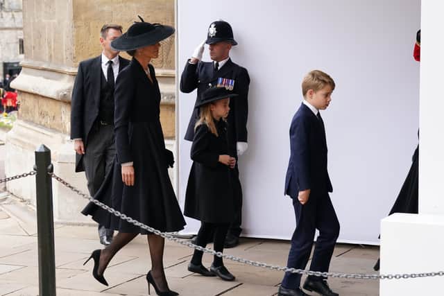 The Princess of Wales, Prince George and Princess Charlotte arrive at the Committal Service for Queen Elizabeth II.