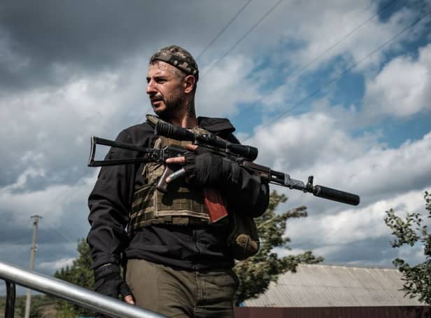 <p>A Ukrainian soldier in the recently recaptured Kharkiv region (image: AFP/Getty Images)</p>
