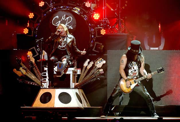 Musician Axl Rose and Slash of Guns N’ Roses performs onstage during day 2 of the 2016 Coachella Valley Music & Arts Festival Weekend 1 at the Empire Polo Club on April 16, 2016 in Indio, California  (Photo by Kevin Winter/Getty Images for Coachella)