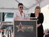 Simon Cowell recalls the day he first met Kelly Clarkson as singer receives star on Hollywood Walk of Fame