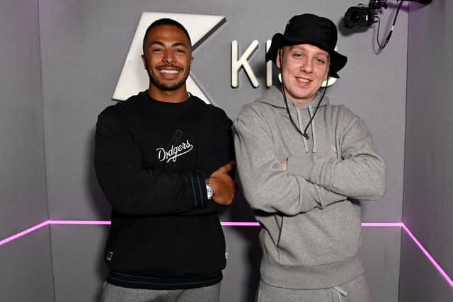 Tyler West and Aitch pose for a photograph at Kiss FM on March 10, 2022