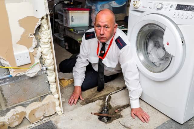 No kitchen sink and a flooded kitchen are among the problems the couple have faced (Photo: Stuart Boulton / SWNS)