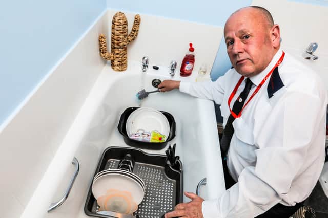 Brian Simpson has been doing the washing up in the bath since January (Photo: Stuart Boulton / SWNS)