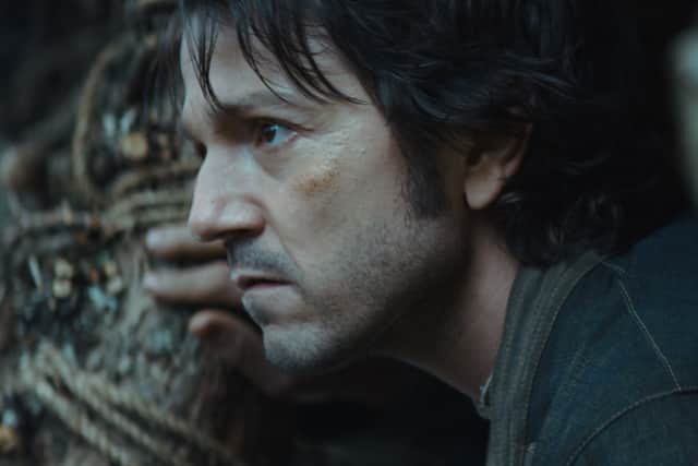 A close-up image of Diego Luna as Cassian Andor, in side profile in a jungle (Credit: Lucasfilm Ltd.)