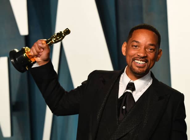 <p>US actor Will Smith holds his award for Best Actor in a Leading Role for "King Richard" as he attends the 2022 Vanity Fair Oscar Party following the 94th Oscars at the The Wallis Annenberg Center for the Performing Arts in Beverly Hills, California on March 27, 2022. (Photo by Patrick T. FALLON / AFP) (Photo by PATRICK T. FALLON/AFP via Getty Images)</p>