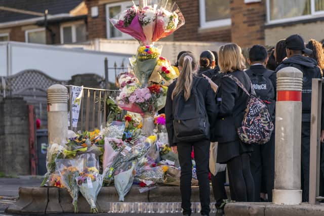 Floral tributes have been left at the scene (Photo: PA)