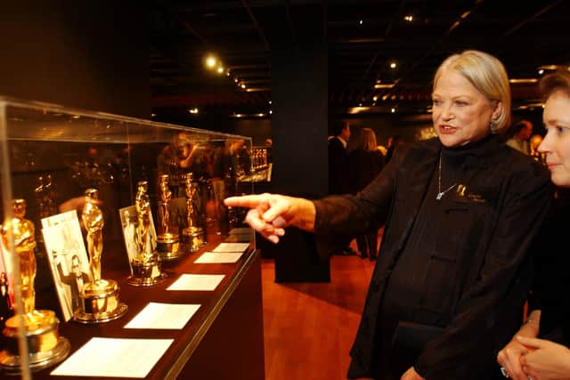 BEVERLY HILLS, CA - JANUARY 23:  Louise Fletcher looks at the Oscar statuette won for Best Actress in 1975 for her role in "One Flew Over the Cukoo's Nest" at the opening of the exhibition "And the Oscar Went To..." on January 23, 2003 in Beverly Hills, California. The exhibit at the Academy of Motion Picture Arts and Sciences features 100 Oscar award statuettes that were presented over the past 75 years.  (Photo by David McNew/Getty Images)  