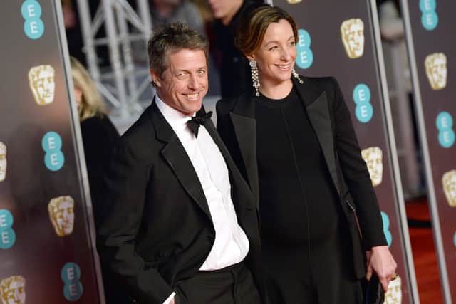 Hugh Grant and Anna Eberstein attend the EE British Academy Film Awards. (Photo by Jeff Spicer/Jeff Spicer/Getty Images)