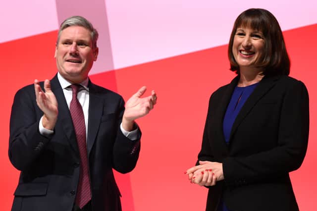 Labour Party leader Keir Starmer applauds Rachel Reeves following her speech on the second day of the Labour Party conference in Liverpool (AFP via Getty Images)