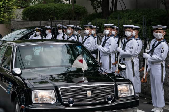 Vehicles drive past members of the Self-Defence Force honour guard as Akie Abe, wife of Japan’s former prime minister Shinzo Abe, heads to the state funeral on September 27, 2022 in Tokyo, Japan (Photo by Tomohiro Ohsumi/Getty Images)