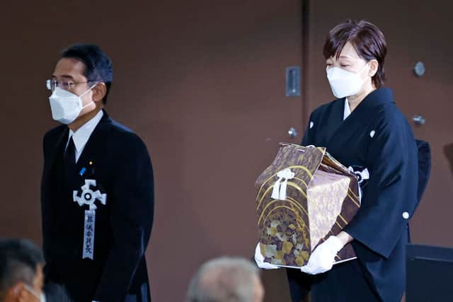Akie Abe, wife of former Japanese Prime Minister Shinzo Abe, carries a box holding Abe’s ashes  during the state funeral for Japan’s former prime minister Shinzo Abe on September 27, 2022 at the Budokan in Tokyo, Japan (Photo by Kim Kyung-hoon/Pool/Getty Images)